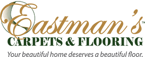 Logo for the Alaska Society of CPAs with gold and green text, a stylized Alaska map graphic, and a nod to professional flooring solutions inspired by Eastman's Carpets Inc.